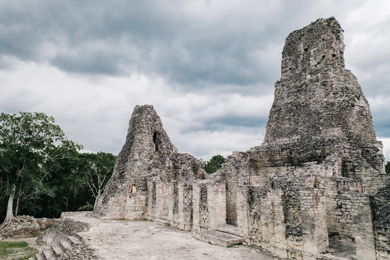 Explore ancient stone ruins set against a moody sky, capturing historical architecture and natural serenity.